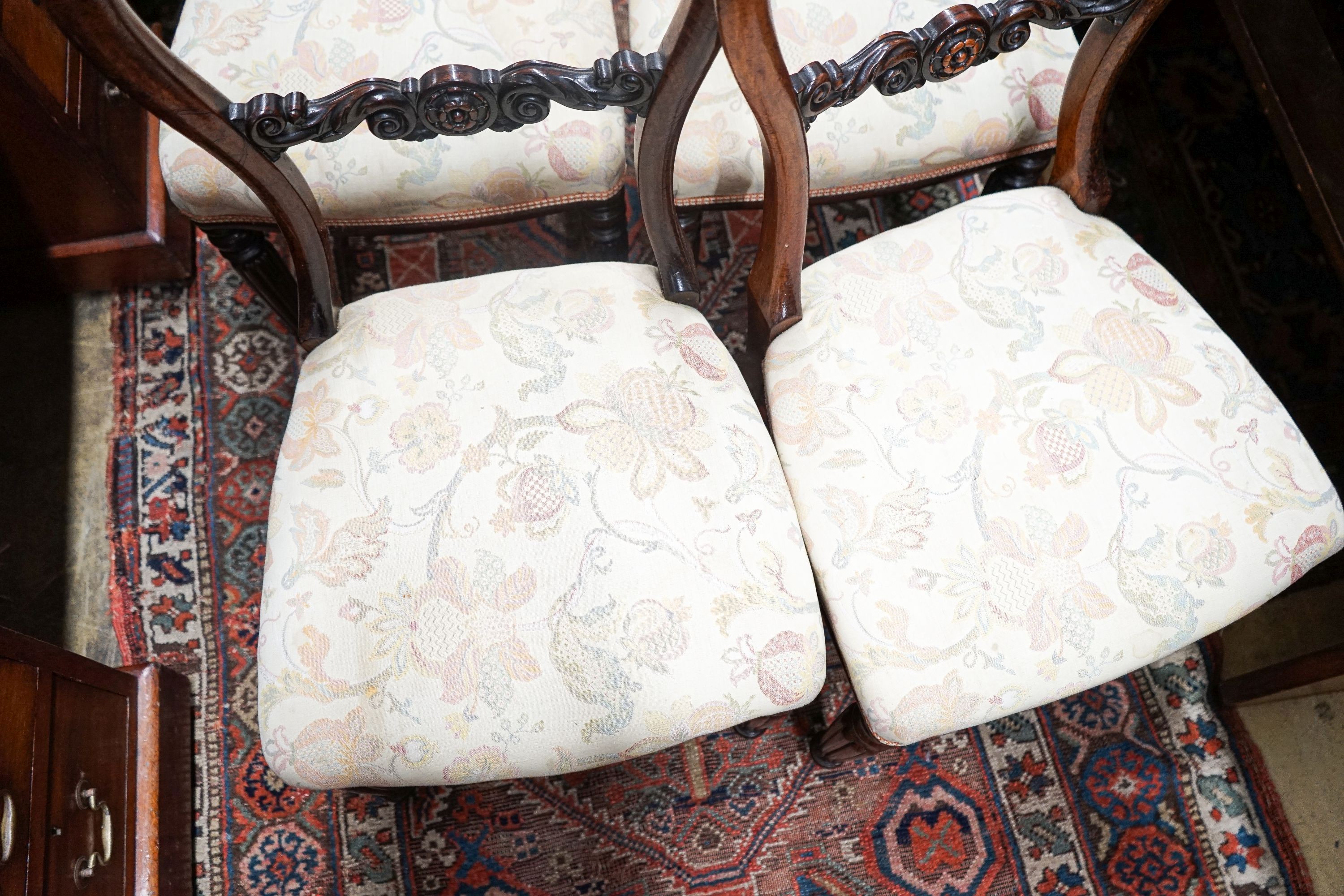 A set of four early Victorian rosewood dining chairs